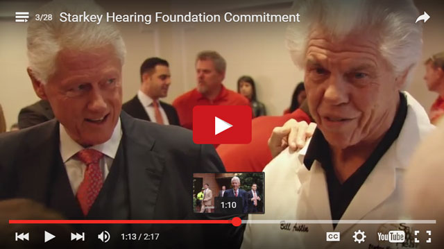 Bill Clinton and Bill Austin of the Starkey Hearing Foundation.