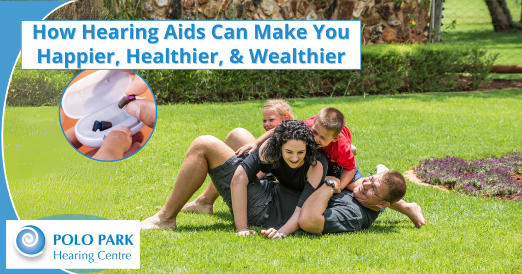 Happy Family playing on lawn mother has hearing aids